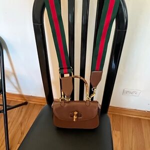 Chic Tan Handbag with Vibrant Strap